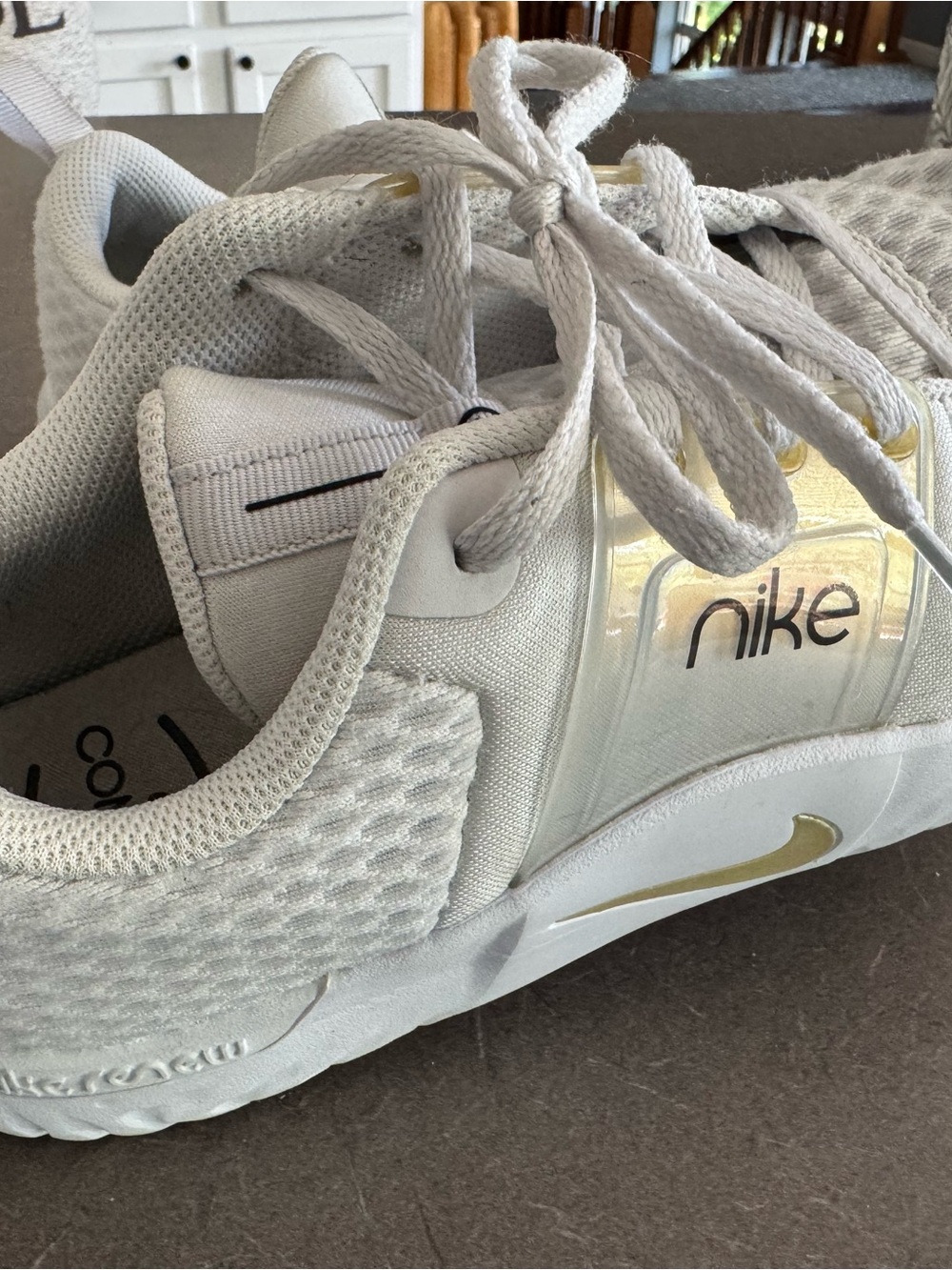 Nike White Sneakers with Gold Accents